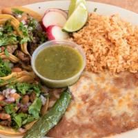 El Patio Street Tacos Platter · Four delicious Guadalajara style tacos topped with meat, whole beans, cilantro, onion, and a...