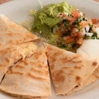Quesadilla · Super sized quesadilla with your choice of shredded chicken or beef. Served with sour cream,...