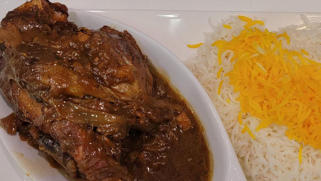 Lamb Shank (Mahicheh) · A whole baby spring lamb shank marinated, slowly cooked in our garlic and onion sauce.