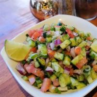 Shirazi Salad  · Juice, Mint) A Mixture of Fresh Chopped Cucumbers, Tomatoes, Green Onions, & House Dressing ...