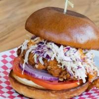 Fried Chicken Sando · Double dipped buttermilk fried chicken, housemade spicy mayo, coleslaw, pickles. Served hot.