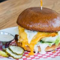 Grilled Chicken Sando · Naked Truth chicken breast, Cheddar cheese, iceberg lettuce, & ranch. Served on a Parker Hou...