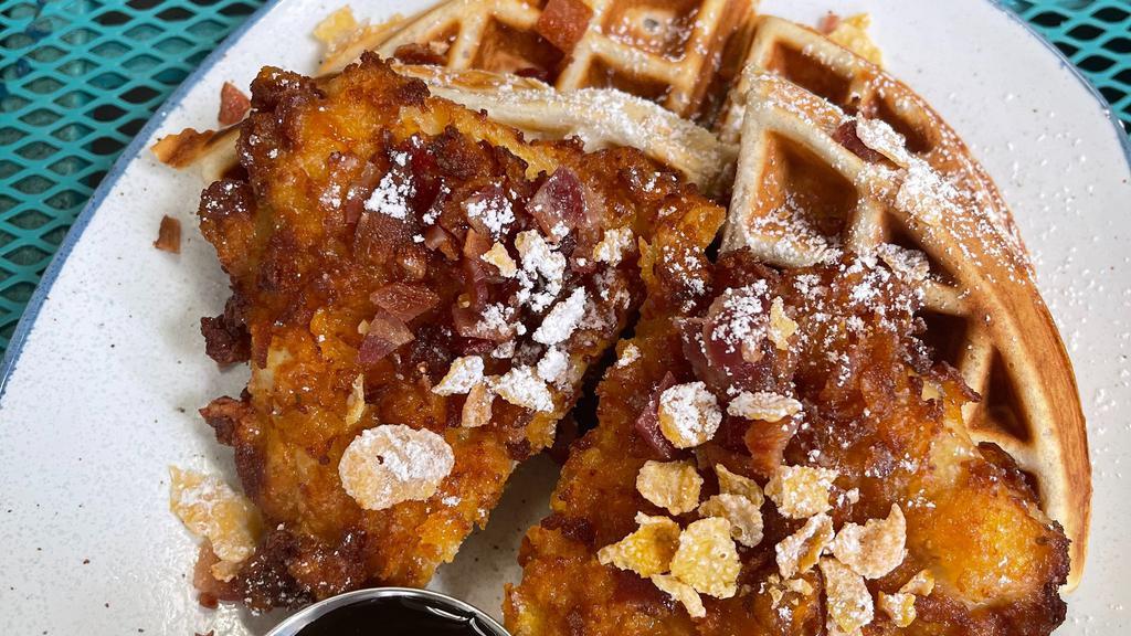 Odd Chicken & Waffle · FROSTED FLAKE CRUSTED CHICKEN BREAST SERVED ON A BELGIAN WAFFLE TOPPED WITH POWDERED SUGAR AND MAPLE SYRUP.