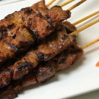 Beef Skewer Lunch Special (5) · Grilled beef on the skewer marinated in kroeung (lemongrass paste), served with pickled carr...