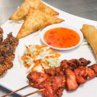 S.E.A. Sampler · Two-beef, two-chicken - skewers, two-egg rolls and two-cream cheese wontons. *If an item is ...