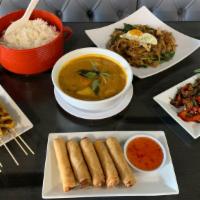 Thai Style · Chicken or tofu egg rolls (5), chicken skewers (5), drunken noodle, chicken curry, basil sti...