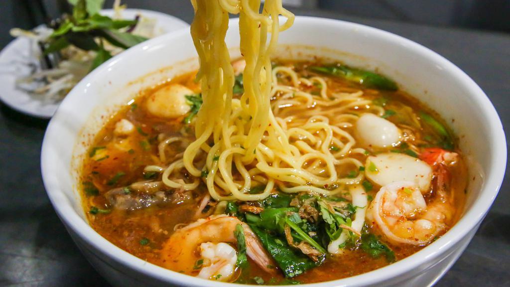 S.E.A. Ramen Bowl · Shrimp, mussel, fish ball, squid, imitation crab meat, oxtail, all in a spicy chicken broth, topped with fried garlic & shallot.