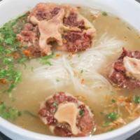 Oxtail Noodle · Rice noodle soup with oxtail pieces that have been braised for several hours, in a savory br...