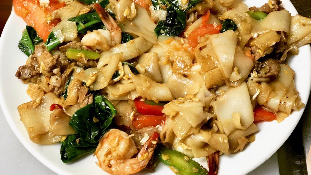 Drunken Noodle (Pad Kee Mao - Thai) · Thick rice noodle sauteed with protein of choice, Chinese broccoli, onion, basil in a sweet soy glaze, topped with an egg. Get it as spicy as you want it or not.