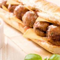 Meatball Sandwich · Homemade meatball slices perfectly stuffed into a sandwich with marinara, mozzarella and che...