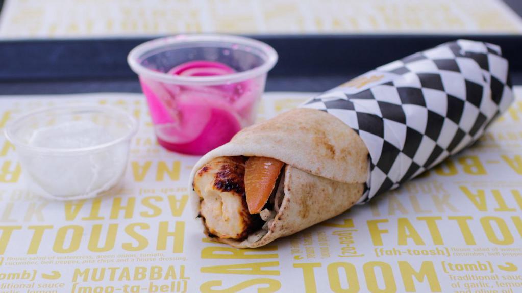 Chicken Kabob Sandwich · Hand-cut pieces of premium white meat marinated with our house seasoning, skewered and grilled on an open fame wrapped in pita with traditional garlic.