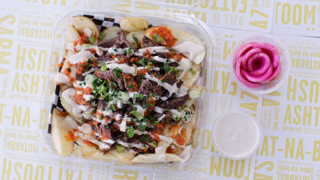 Shawarma Fries · Flame - broiled, marinated beef piled on fresh hand-cut fries, drizzled with tahini sauce.