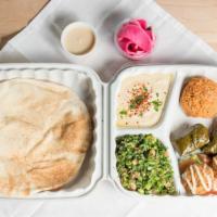 Veggie Plate · Made to order falafel, stuffed grape leaves, quinoa salad served with tabouleh or garden sal...