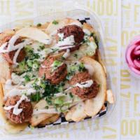 Falafel Fries · Vegan. Made to order falafel, served on fresh hand-cut fries, drizzled with tahini sauce.