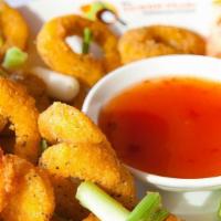 Fried Calamari · Lightly battered calamari rings fried to a golden brown, served with sweet chili sauce.