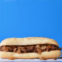 Steak Sandwich · Philly steak sandwich loaded with grilled steak and onions on a toasted hoagie roll