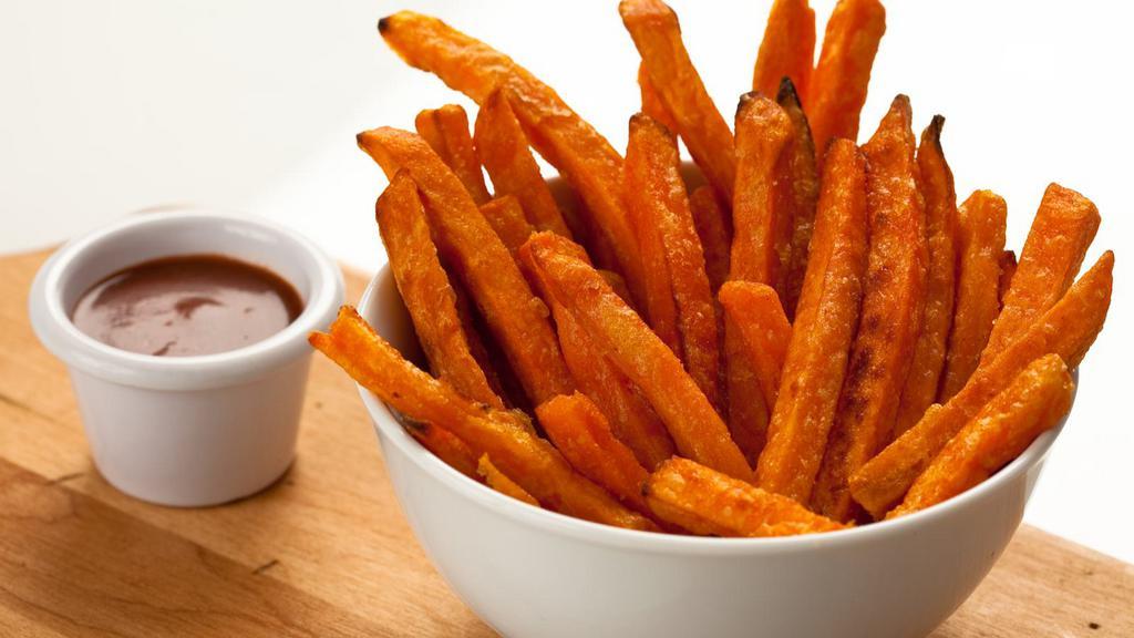 Sweet Potato Fries · Delicious Sweet potato fries deep fried 'till golden brown, with a crunchy exterior and a light fluffy interior. Seasoned to perfection!