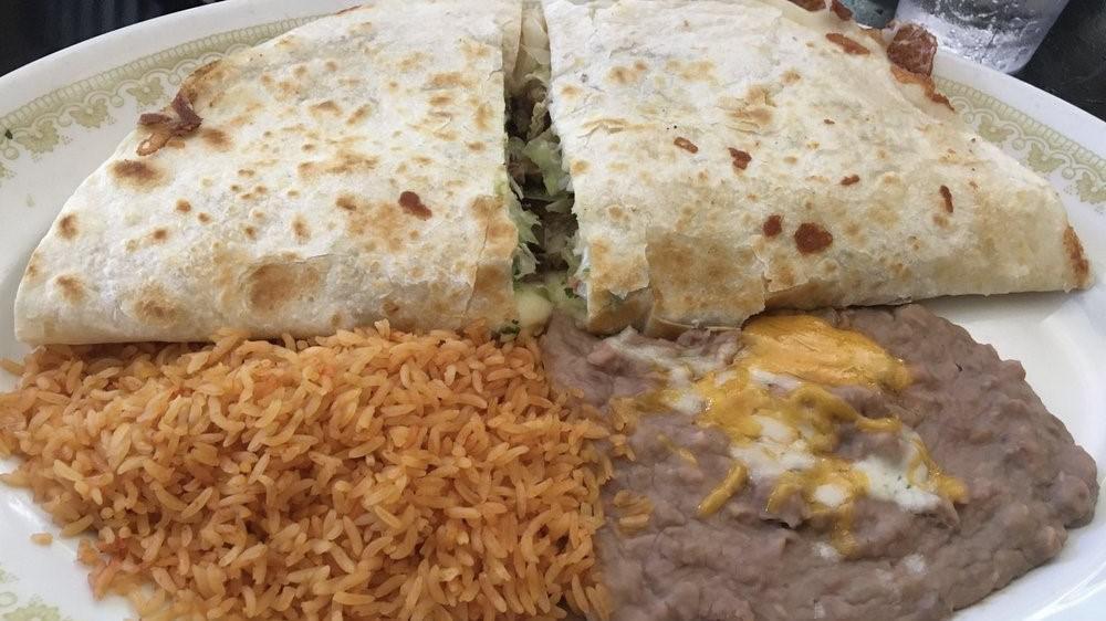 Cheese Quesadilla · A large king sized, Flour Tortilla loaded with melted Cheese served with Guacamole and sour cream on the side.