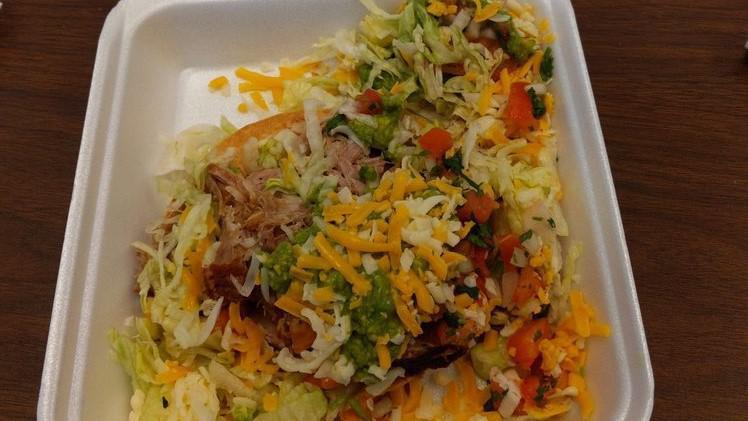Tostadas · A crispy corn tortilla layered with refried beans with your choice of chicken, carne asada (steak) or carnitas (pork) topped with lettuce, guacamole, pico de gallo, jack & cheddar cheese.