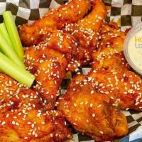 Chicken Wings (8Pc) · Chicken wings tossed in our flavorful buffalo wings sauce. 1 side of ranch to dip.