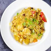 Pineapple Fried Rice · Chicken, shrimp, eggs, curry powder, bell peppers, pineapple, onions, cashews and raisins.