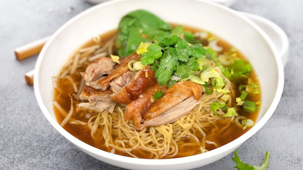 Roasted Duck Noodle · Roasted duck, bean sprouts baby bok choy, scallions in brown herb soup.