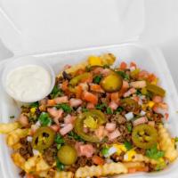 Asada Fries · Crinkle cut fries loaded with asada, cheese, onion, cilantro, tomato, jalapeño, and sour cre...