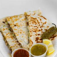 Quesadilla · Meat of your choice topped with mozzarella cheese, onions, cilantro, and cabbage.
