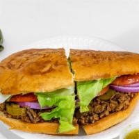 Torta · Meat of your choice topped with, onion, avocado, tomato, lettuce, on torta bread with mayonn...