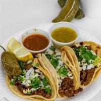 3 Tacos · Meat of your choice topped with onions, cilantro, and cabbage.