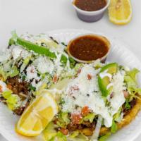 Sope · Meat of your choice, beans, cilantro, lettuce, tomato, avocado, queso cotija, and sour cream...