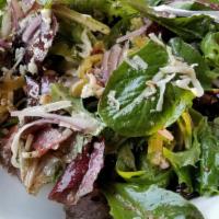 Large Antipasto Salad · Seasonal greens, green olives, mozarella, red onion, pepperoncini, crispy salami with homema...