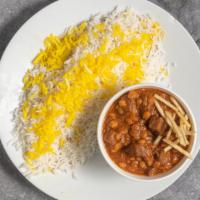 Gheimeh · Cooked chunks of beef with yellow split peas in tomato sauce, topped with show string potato...