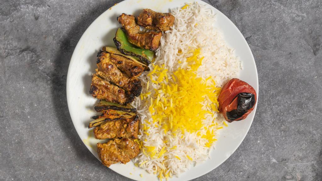   Lamb Shish Kabob · Marinated chunks of lamb with bell peppers and onions, served with grilled tomato and basmati rice.