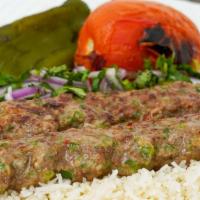 Special Beef Lula Kebab · Grilled beef ground meat, jalapeno and mozzarella cheese, served with rice or vegetables, la...