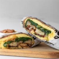 The Stan'Off Breakfast Burrito With Bacon · Eggs, bacon, caramelized onions, cheddar cheese, tater tots, spinach, ranchero sauce, whole ...