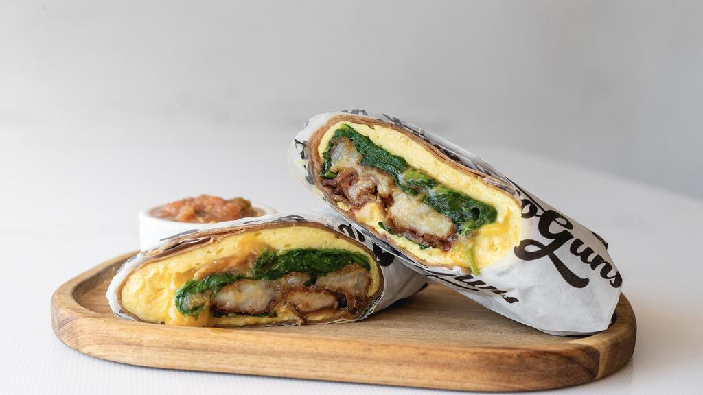 The Stan'Off Breakfast Burrito With Bacon · Eggs, bacon, caramelized onions, cheddar cheese, tater tots, spinach, ranchero sauce, whole wheat tortilla