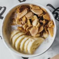Oatmeal · Hot steel-cut oats served with banana, mixed nuts, honey and coconut milk