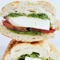 Caprese · Sliced tomatoes, fresh mozzarella cheese, and homemade pesto sauce. Contains pine nuts.