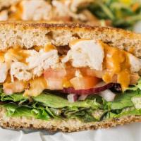 Chipotle Chicken Sandwich · Pulled rotisserie chicken, melted white cheddar cheese, and chipotle sauce, mixed greens, to...
