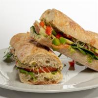 Vegetarian Sandwich · Hummus, tomatoes, bell peppers, cucumbers, avocado & sprouts.