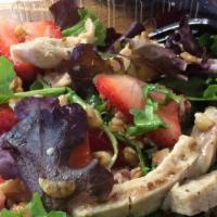Strawberry Fields Salad · Mix greens, arugula, strawberries, carrots, red onions, feta cheese, raspberry vinaigrette o...