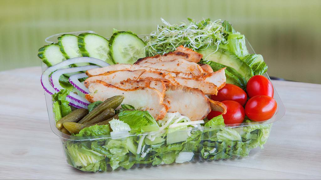 Grilled Chicken Salad · Crisp hand cut romaine lettuce, fresh avocado, sliced cucumber, shredded Jack cheese, ripe grape tomatoes, baby dill pickles, fresh sliced red onion, and sprouts. Your choice of dressing: Italian, 1000 island, oil and vinegar, Blue cheese, or ranch.