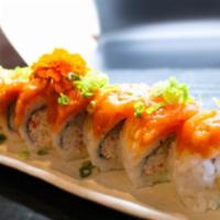 Salmon Crazy Roll · In: crab meat, cucumber, shrimp tempura. Top: spicy salmon, green onion. Sauce: eel and spic...