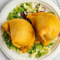 Samosa · Vegetarian. A small triangular pastry filled with spiced potato, peas filling, and fried in ...