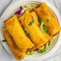 Spring Roll (6 Pieces) · Vegetarian. Indo-chinese cooked vegetables, rolled in thin wonton wrappers, and deep-fried t...