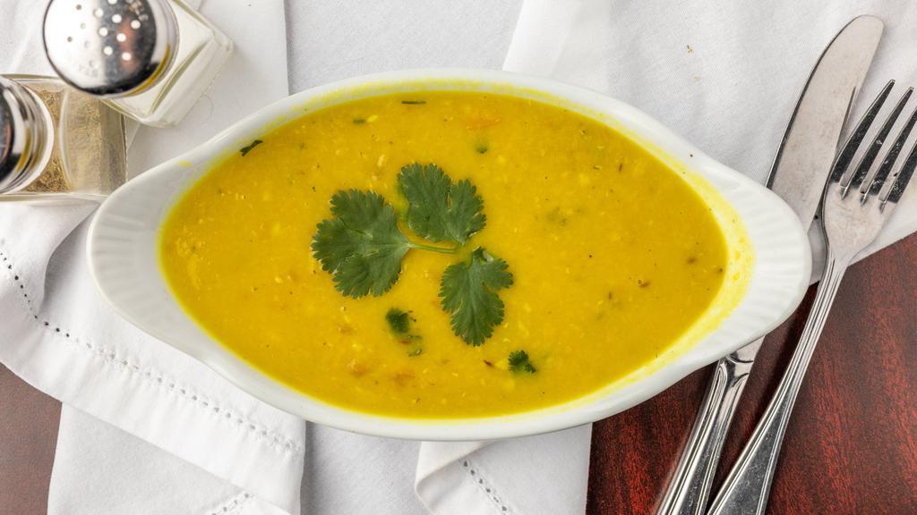 Dal Tadka · Vegetarian. A delicious scrumptious bowl of health and taste made with yellow lentils, tempered with ghee, fried spices, onion, and tomato.