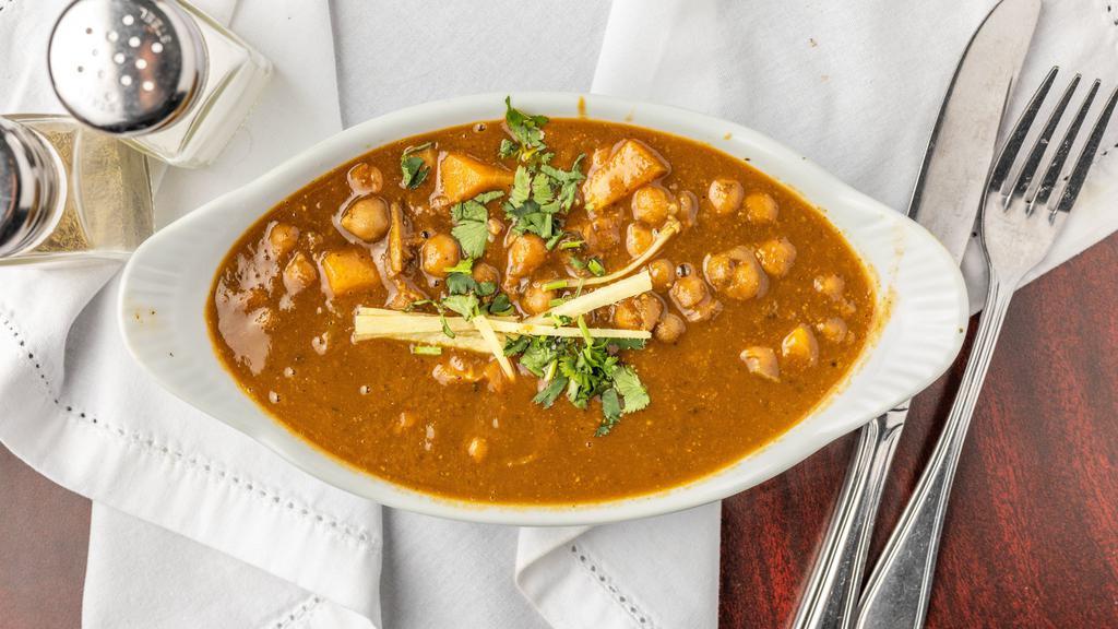 Pindi Chola · Popular Punjabi delicacy, a semi dry chickpea curry assorted with aromatic spices, ginger, tomato and onions.