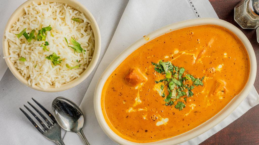 Chicken Tikka Masala · Boneless chicken pieces marinated in spiced yogurt mixture and traditionally cooked then simmered with subtle tomato and cream curry.