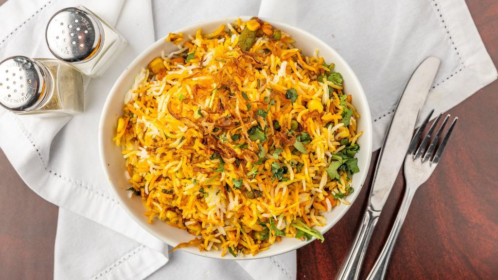 Veg Biryani · Vegetarian. An irresistible aromatic vegetarian rice dish made with basmati rice, boldly spiced veggies, and herbs.